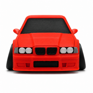 Front view of a red BMW E36 M3 tooned 3D printed desk model on a white background.