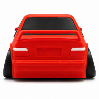 Rear view of a red BMW E36 M3 tooned 3D printed desk model on a white background.