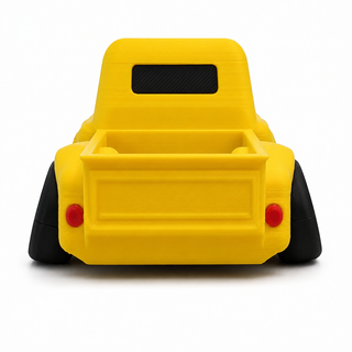 Yellow Classic Pickup Tooned 3D Printed Desk Model shown from the rear angle on a white background.