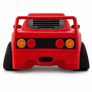 Rear view of a red Ferrari F40 tooned 3D printed desk model on a white background.      