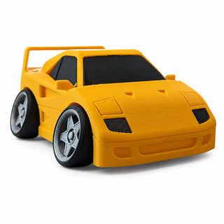 Yellow Ferrari F40 tooned 3D printed desk model shown from the front three-quarter view on a white background.
