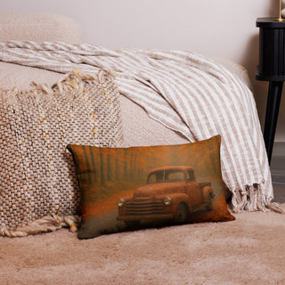Rustic lumbar pillow featuring a vintage pickup truck parked on an autumn forest road, styled in a cozy home setting with neutral blankets and woven textures.