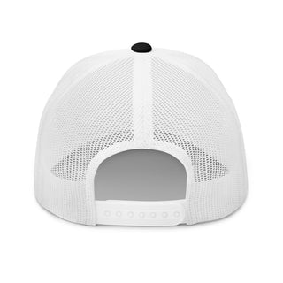 Back view of a black and white snapback trucker cap showing the white mesh panels and adjustable closure