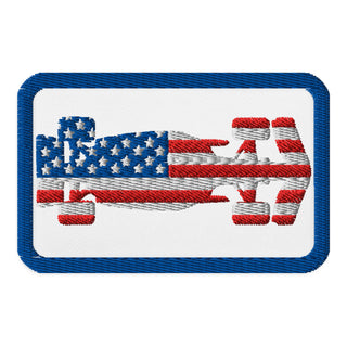USA flag formula racing car embroidered patch with white background and red, white and blue racing design.