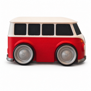 Side profile of a red and white Volkswagen T1 Bus tooned 3D printed desk model on a white background.